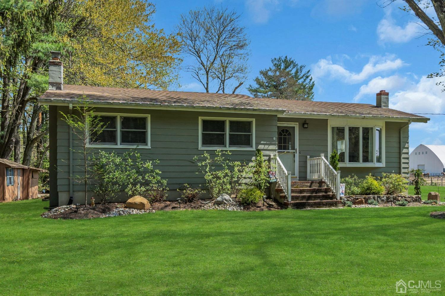 247 Davidson's Mill Road Monroe Township, NJ 08831 - Photo 1 of 55 a front view of a house with a yard