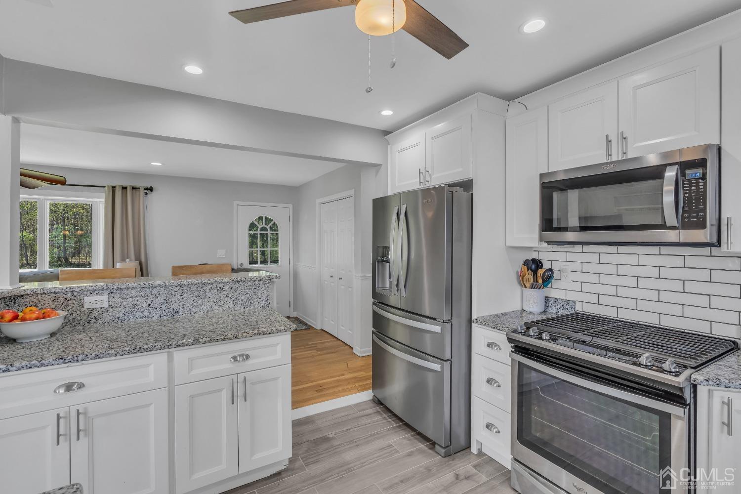 247 Davidson's Mill Road Monroe Township, NJ 08831 - Photo 15 of 55 a kitchen with stainless steel appliances granite countertop a stove a refrigerator and a microwave