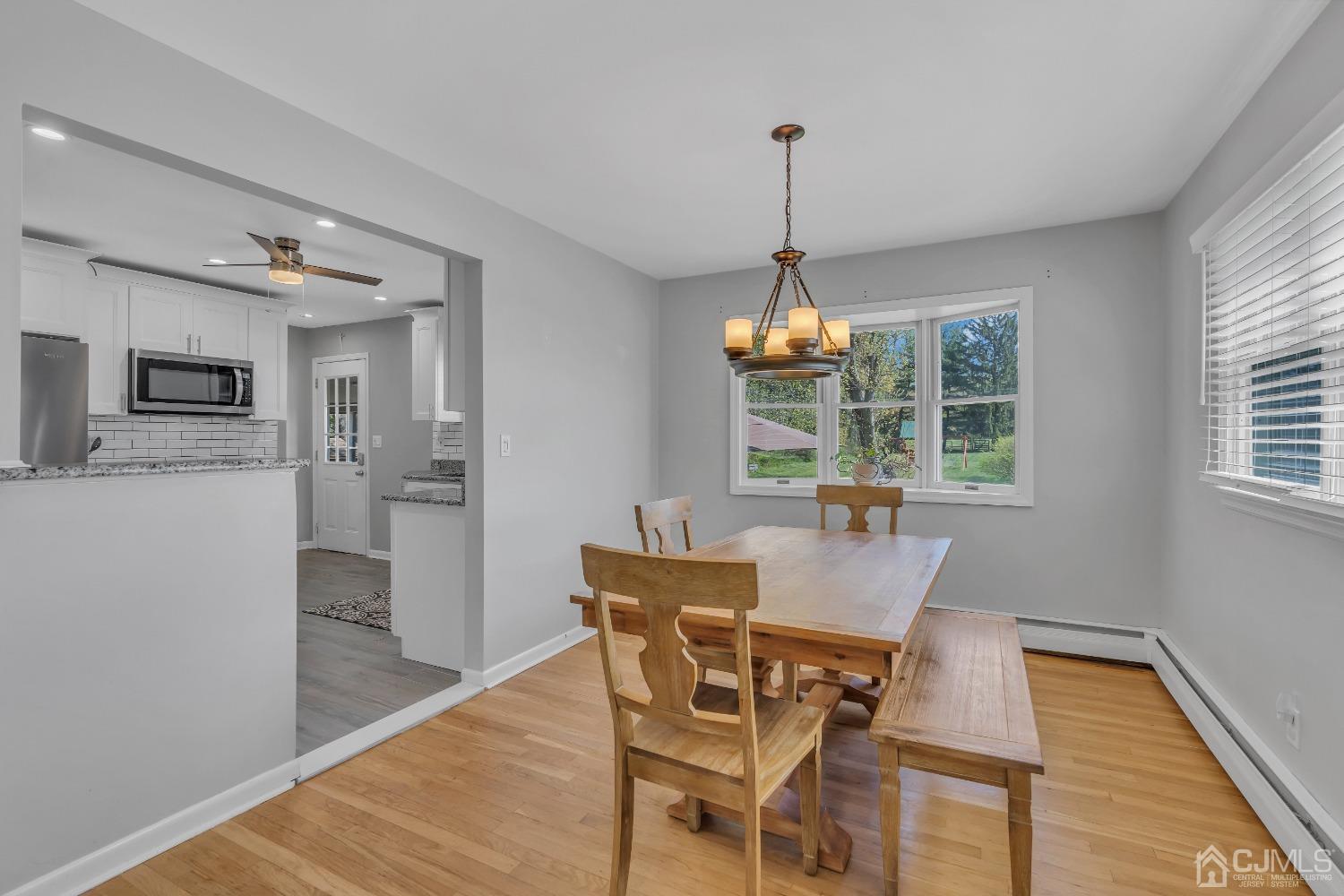 247 Davidson's Mill Road Monroe Township, NJ 08831 - Photo 18 of 55 a view of a dining room with furniture window and wooden floor