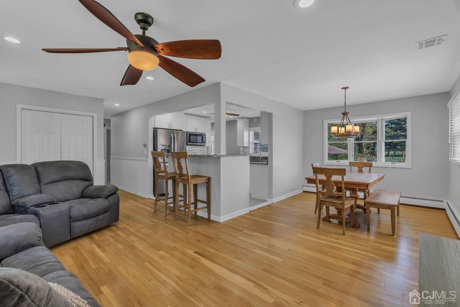 247 Davidson's Mill Road Monroe Township, NJ 08831 - Photo 20 of 55 a living room with furniture wooden floor and dining table