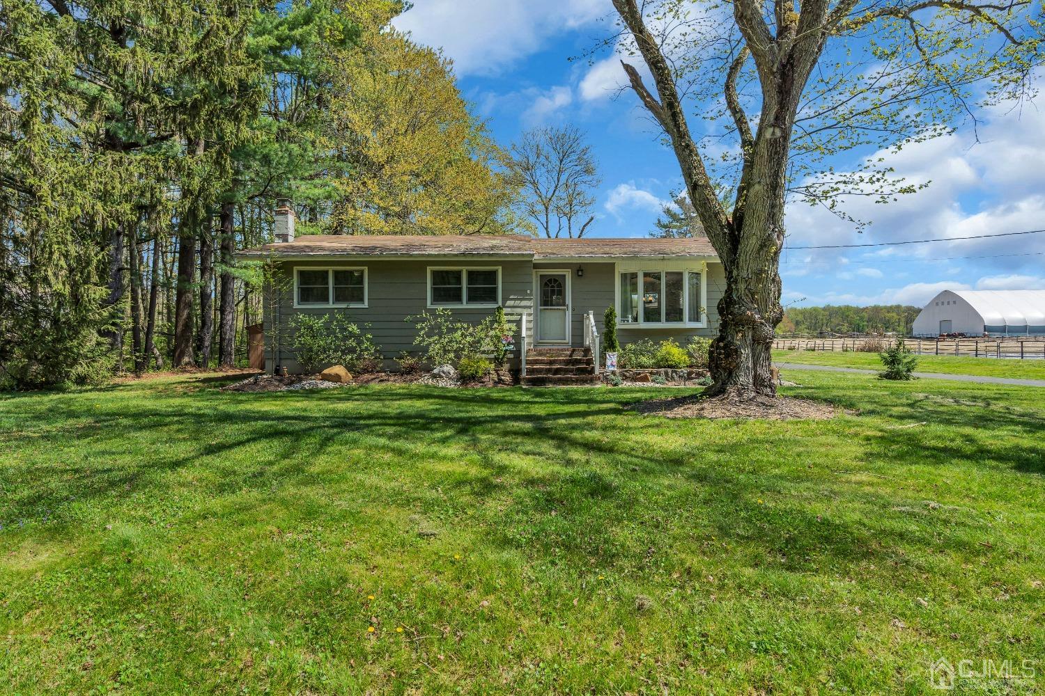 247 Davidson's Mill Road Monroe Township, NJ 08831 - Photo 2 of 55 a front view of house with yard garden and outdoor seating