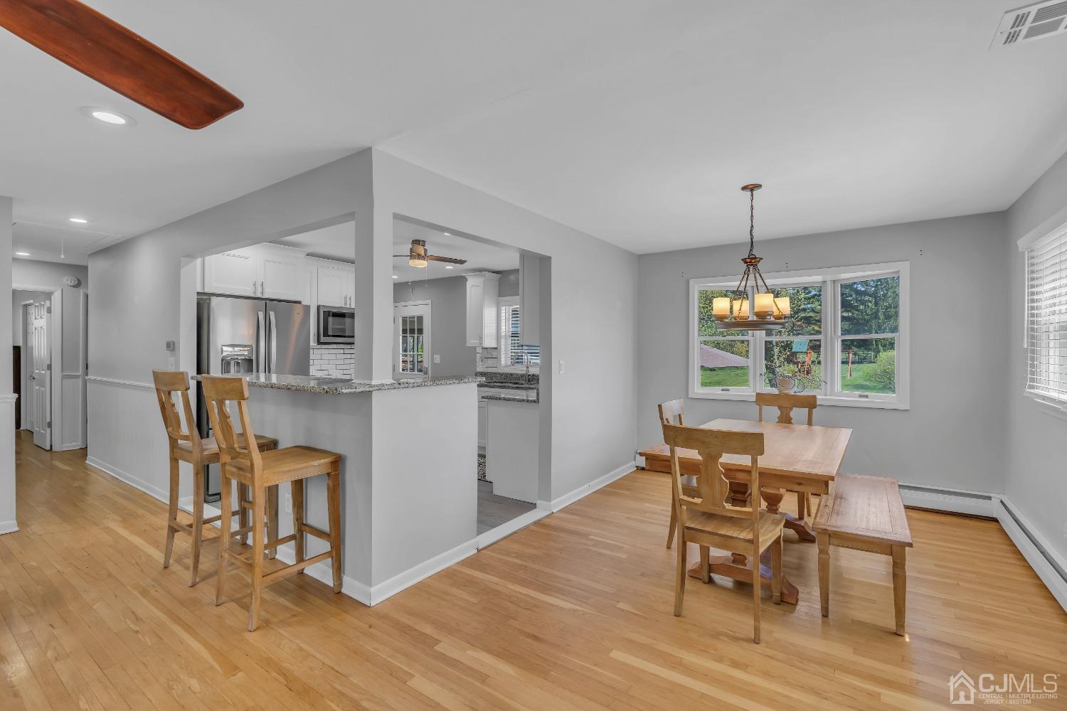 247 Davidson's Mill Road Monroe Township, NJ 08831 - Photo 21 of 55 a view of a dining room with furniture and wooden floor