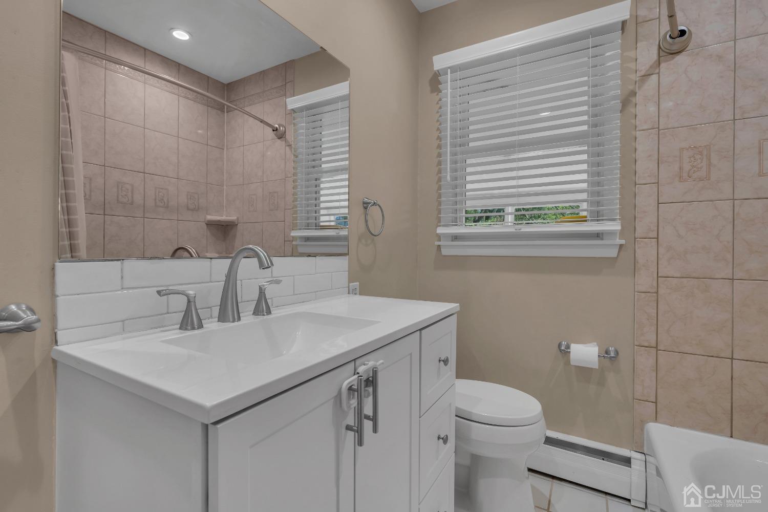 247 Davidson's Mill Road Monroe Township, NJ 08831 - Photo 26 of 55 a bathroom with a sink toilet and window