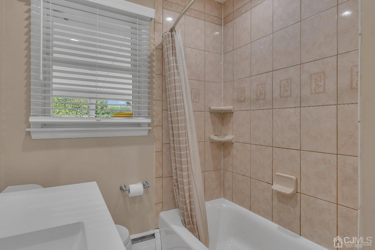 247 Davidson's Mill Road Monroe Township, NJ 08831 - Photo 27 of 55 a bathroom with a toilet and bathtub