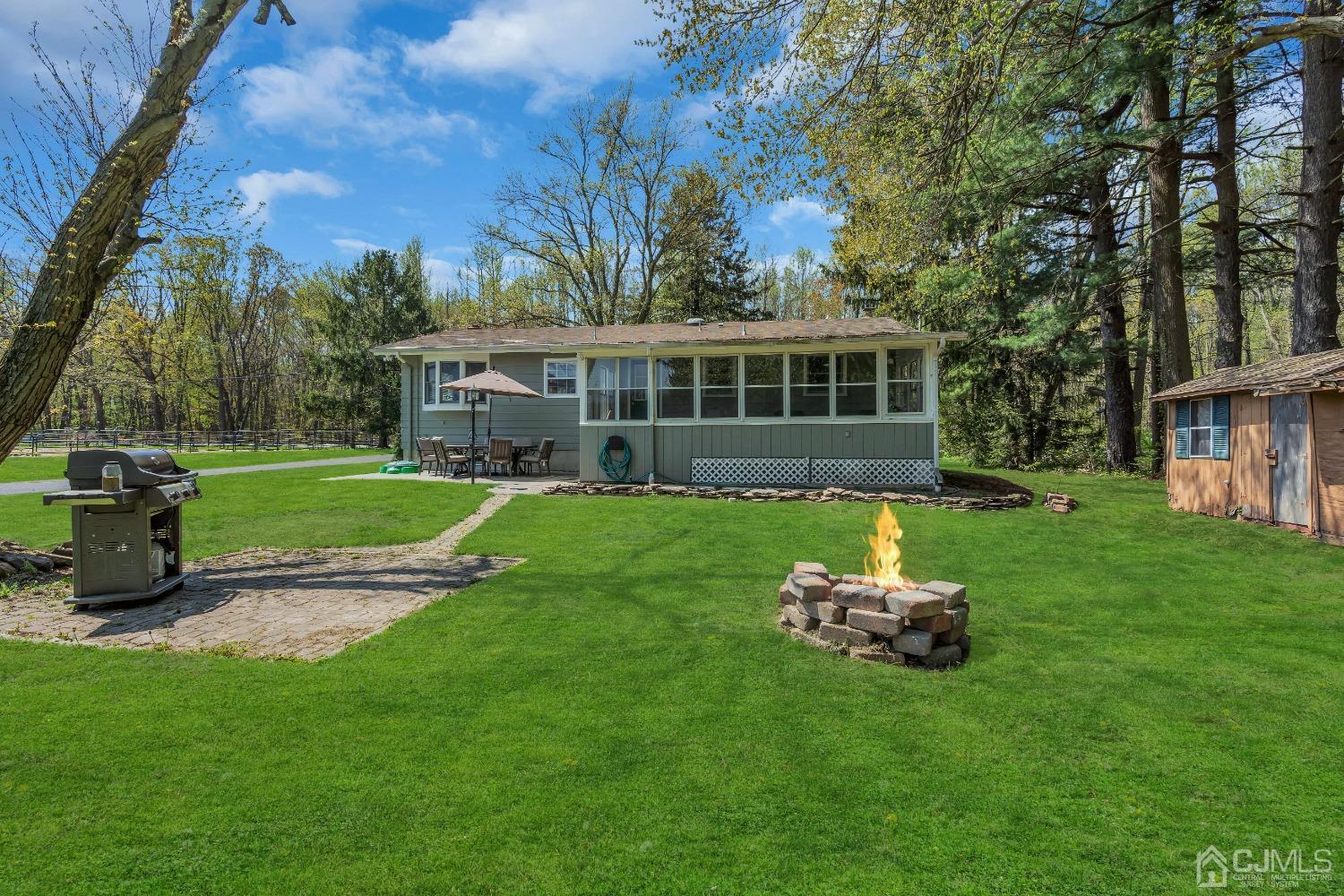 247 Davidson's Mill Road Monroe Township, NJ 08831 - Photo 38 of 55 a house with garden in front of it