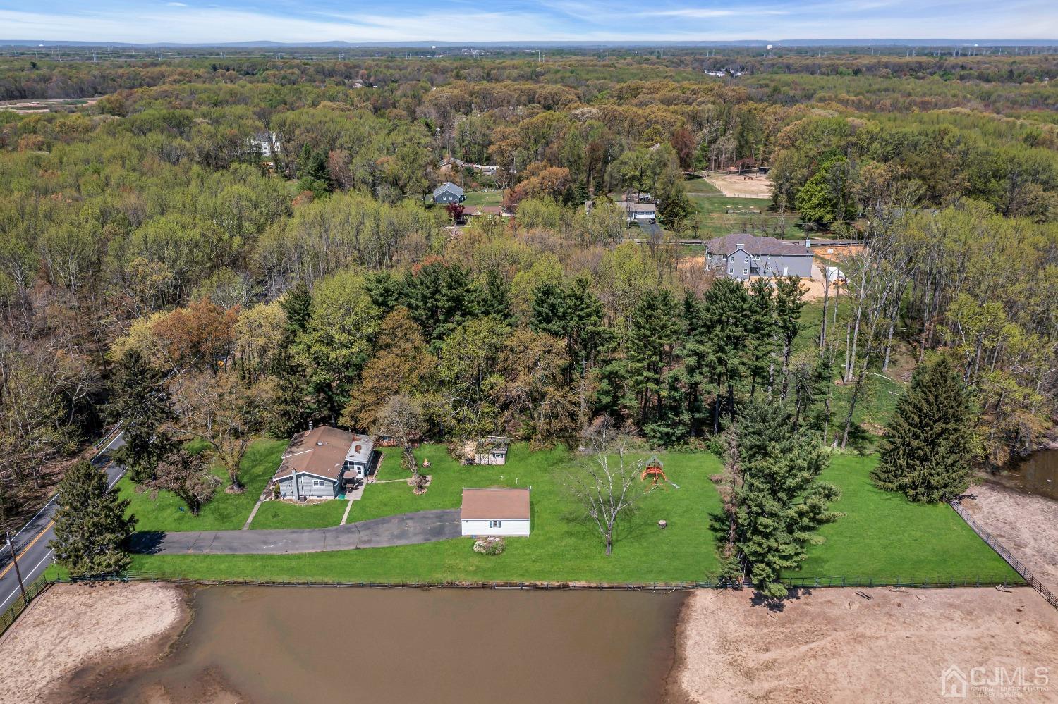 247 Davidson's Mill Road Monroe Township, NJ 08831 - Photo 46 of 55 an aerial view of residential houses with outdoor space and trees