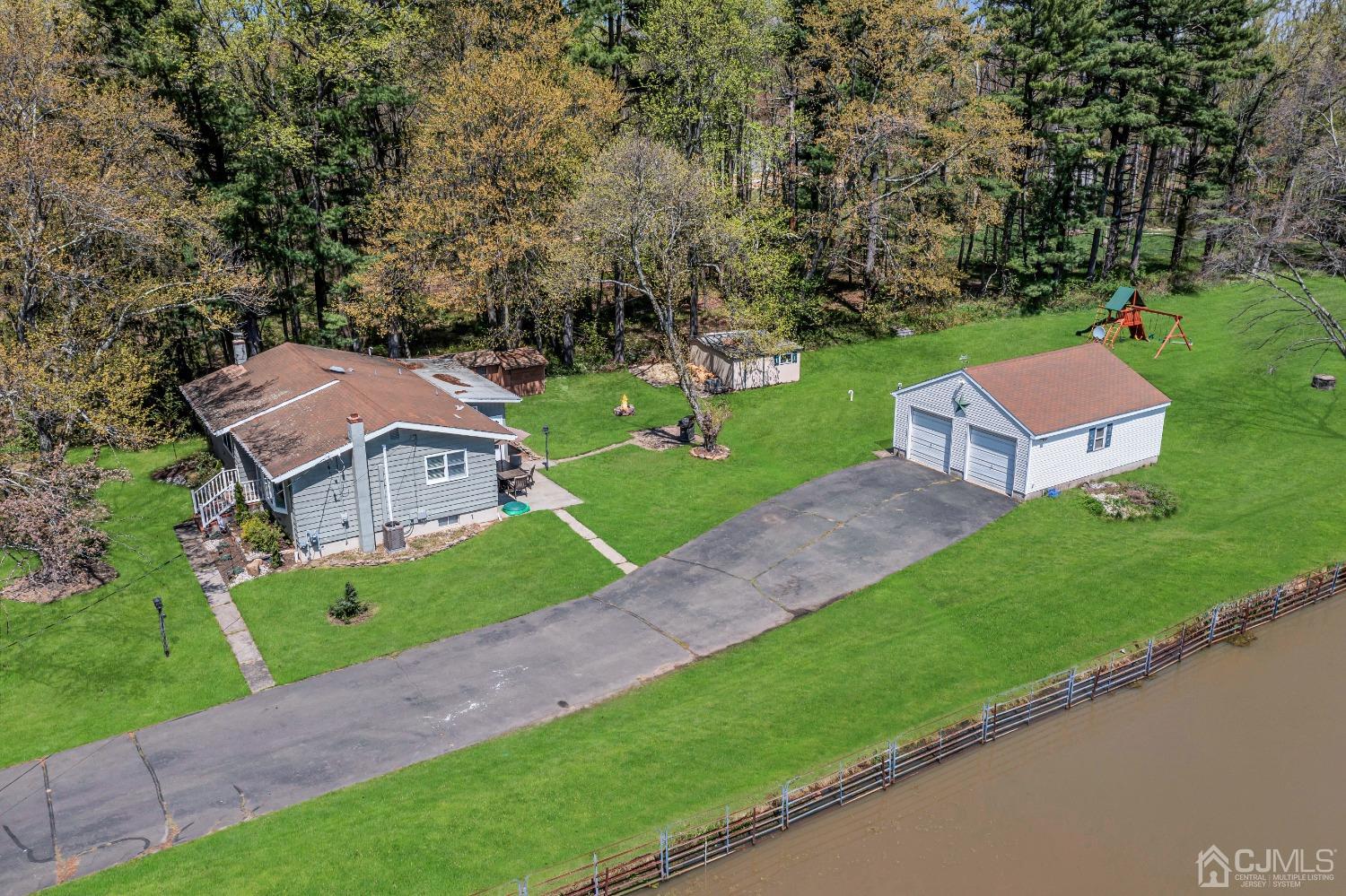 247 Davidson's Mill Road Monroe Township, NJ 08831 - Photo 49 of 55 an aerial view of a house with a garden and trees