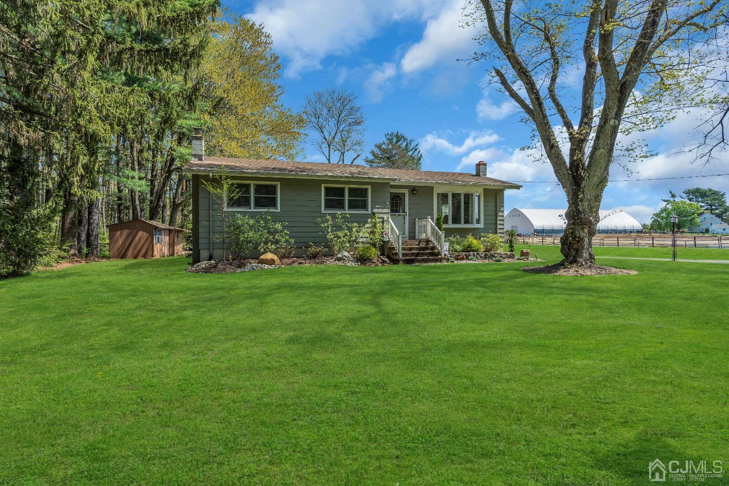 247 Davidson's Mill Road Monroe Township, NJ 08831 - Photo 5 of 55 a front view of a house with garden