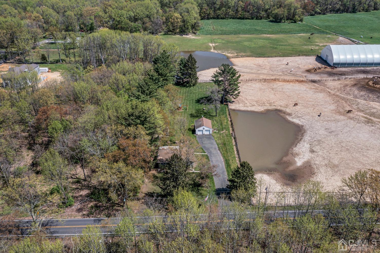 247 Davidson's Mill Road Monroe Township, NJ 08831 - Photo 51 of 55 a view of a street with a yard