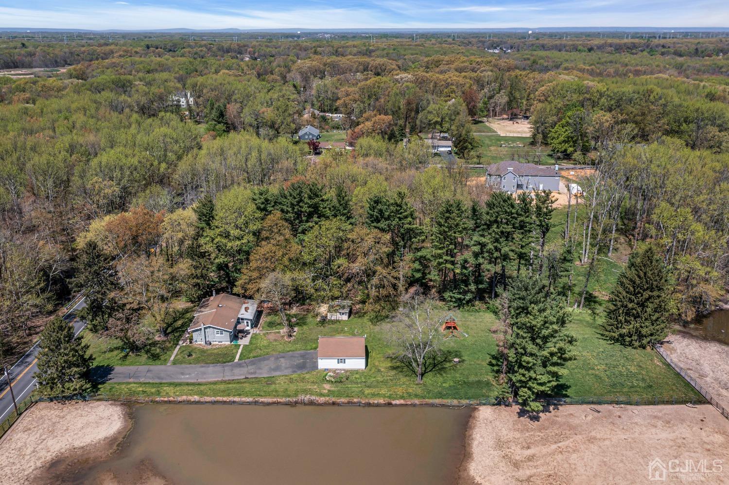 247 Davidson's Mill Road Monroe Township, NJ 08831 - Photo 52 of 55 an aerial view of a house with a yard