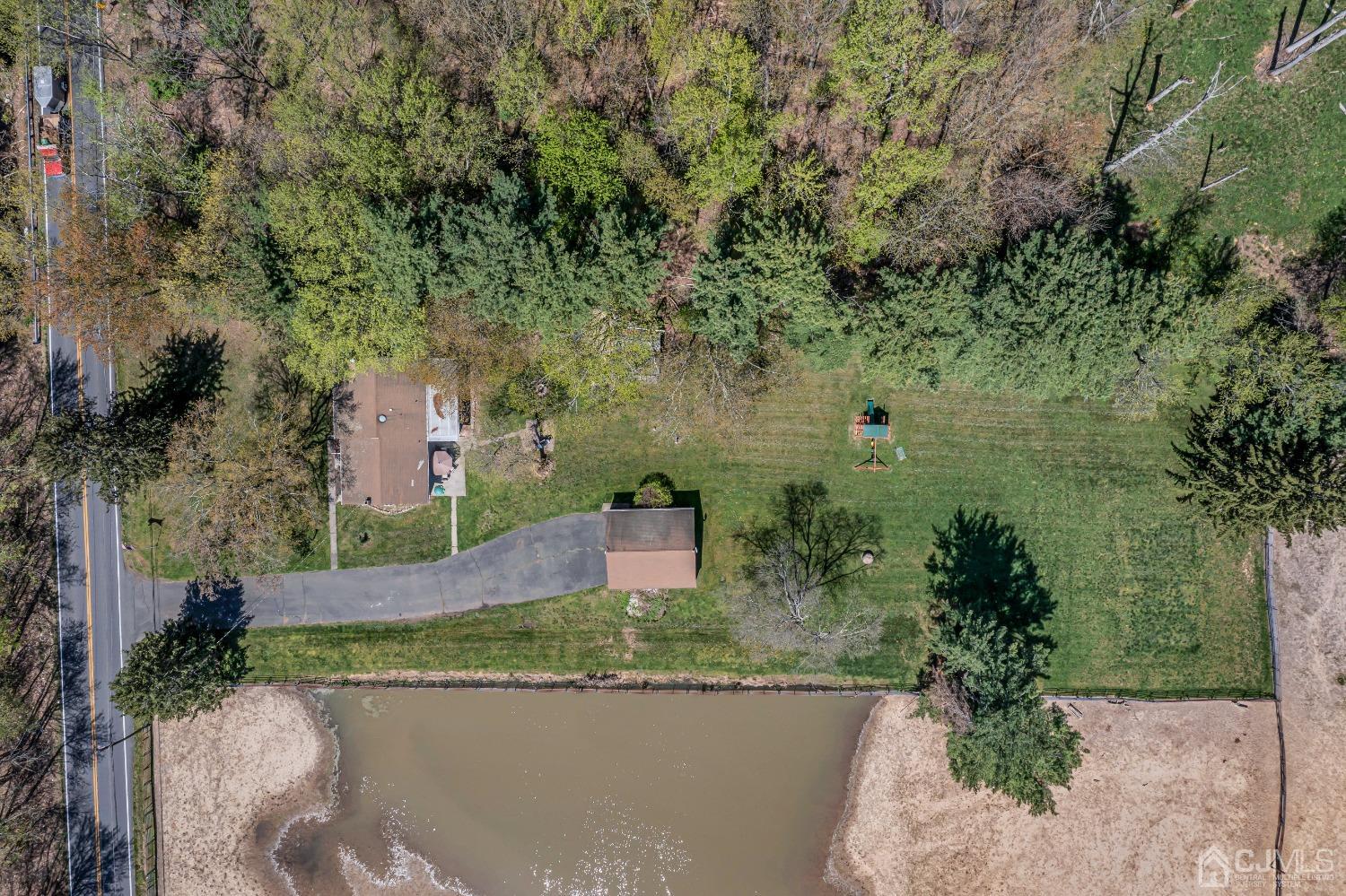 247 Davidson's Mill Road Monroe Township, NJ 08831 - Photo 53 of 55 an aerial view of a house with a yard and lake view