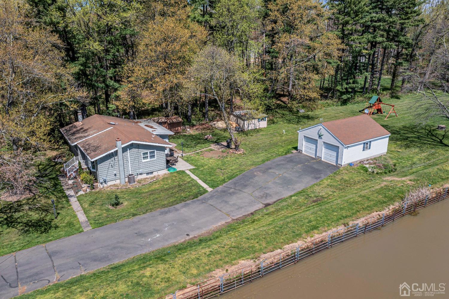 247 Davidson's Mill Road Monroe Township, NJ 08831 - Photo 54 of 55 an aerial view of a house with a garden and a yard