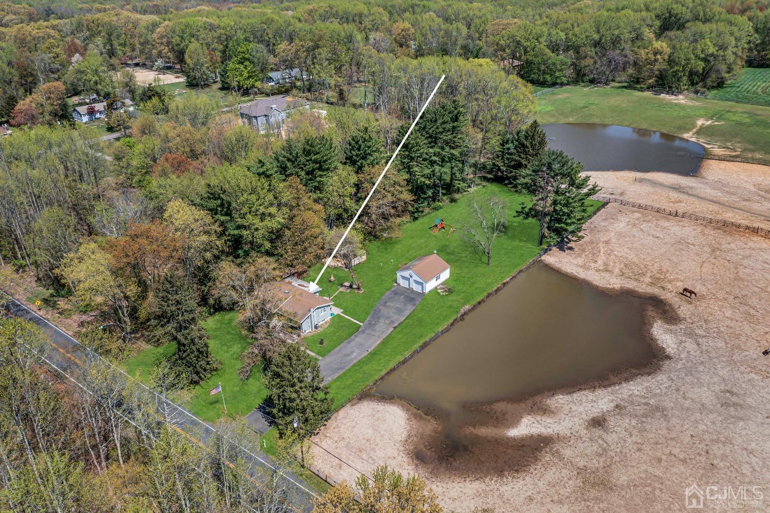 247 Davidson's Mill Road Monroe Township, NJ 08831 - Photo 55 of 55 a view of a garden with a lake