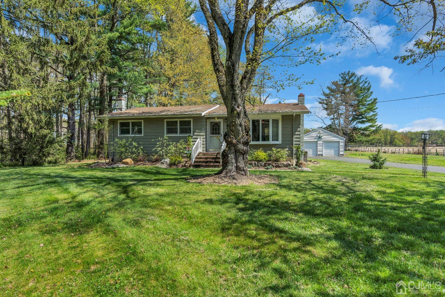 247 Davidson's Mill Road Monroe Township, NJ 08831 - Photo 6 of 55 a front view of house with yard and green space