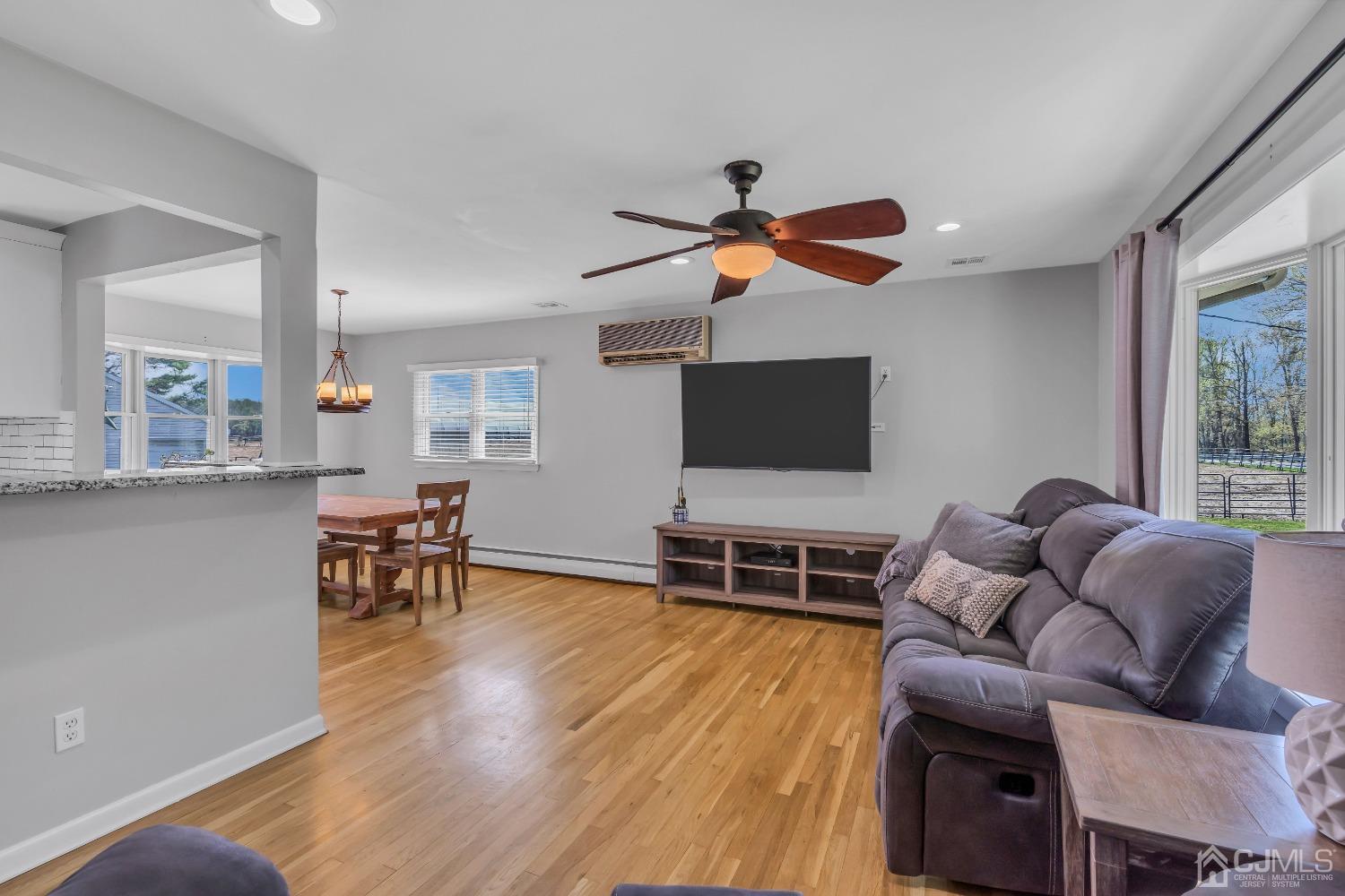 247 Davidson's Mill Road Monroe Township, NJ 08831 - Photo 9 of 55 a living room with furniture and a flat screen tv