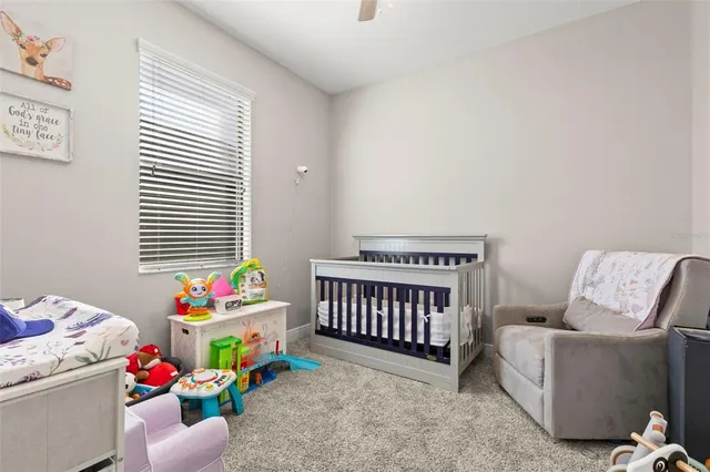a bedroom with furniture and a window