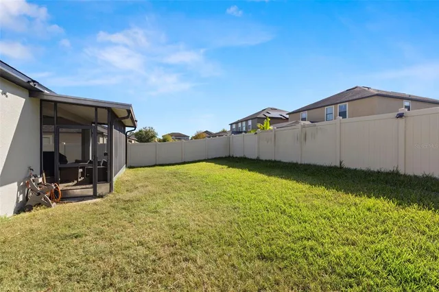 a view of a back yard of the house