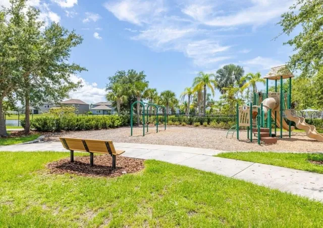 a swimming pool with outdoor seating and yard