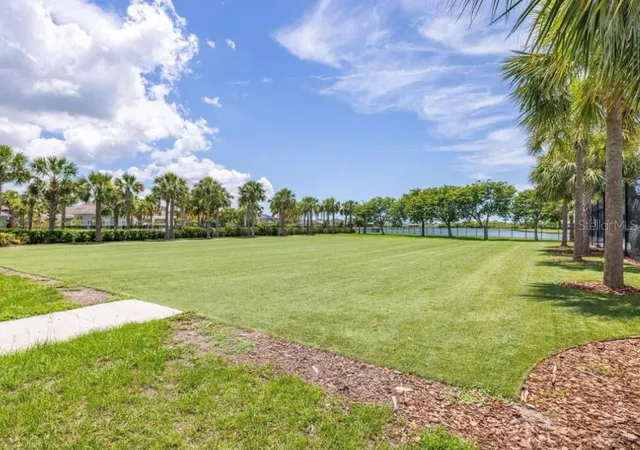 a view of a lake with a big yard
