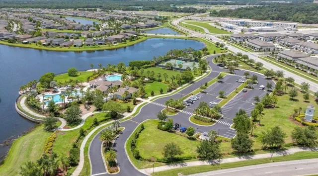 a view of a swimming pool with a yard