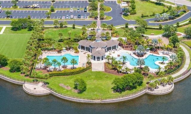 a view of a swimming pool with some plants