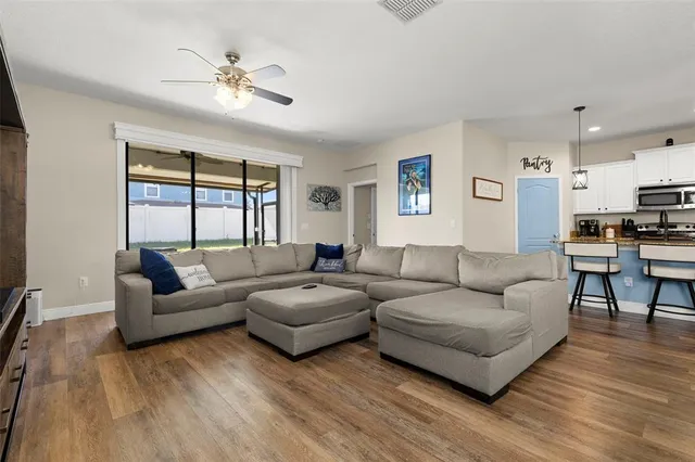 a living room with furniture and a large window