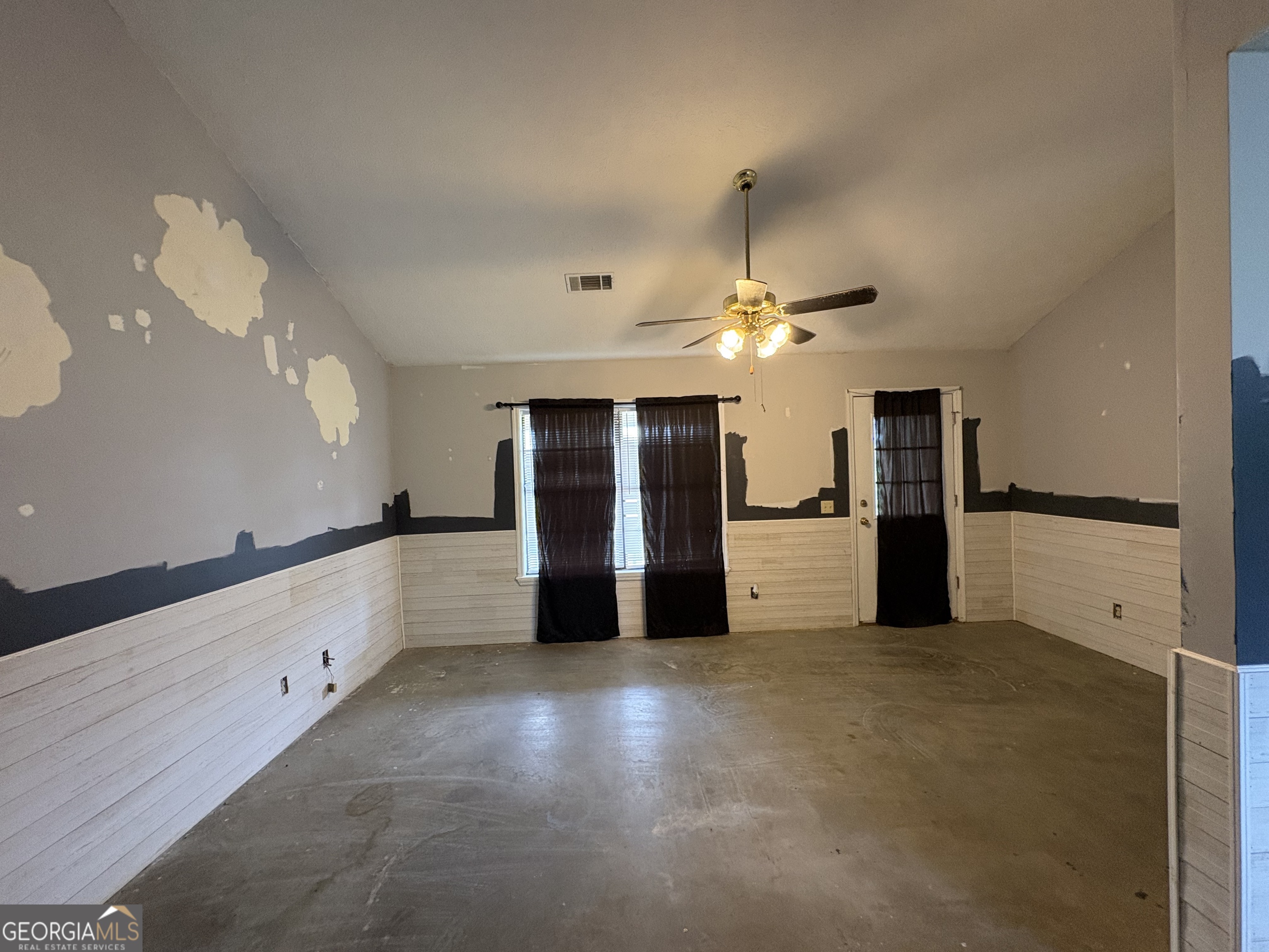 129 Cherry Street Alston, GA 30473 - Photo 3 of 4 a view of a kitchen with a sink and stainless steel appliances