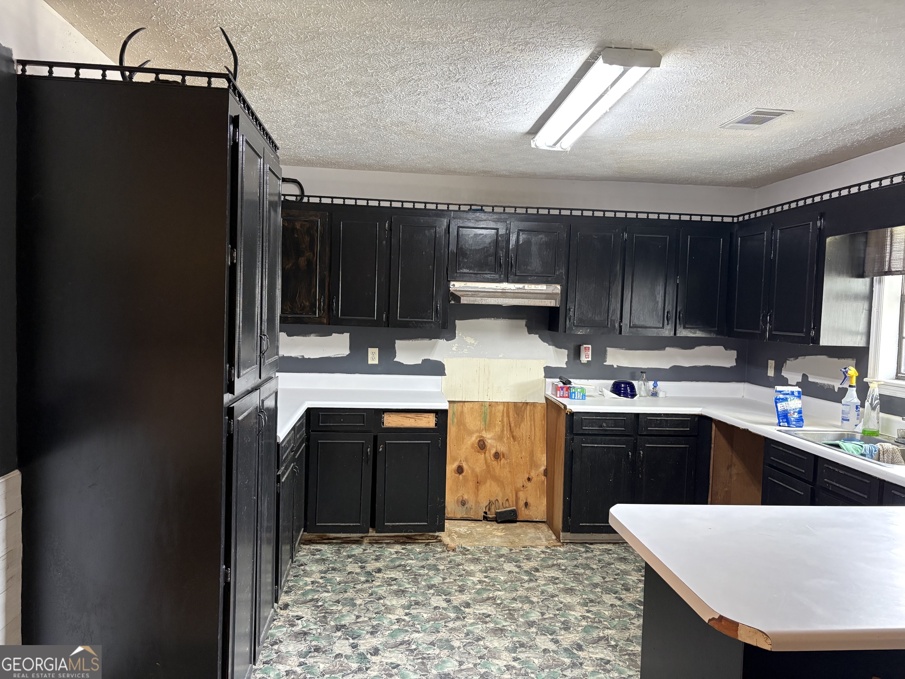 129 Cherry Street Alston, GA 30473 - Photo 4 of 4 a kitchen with appliances cabinets and a counter top space
