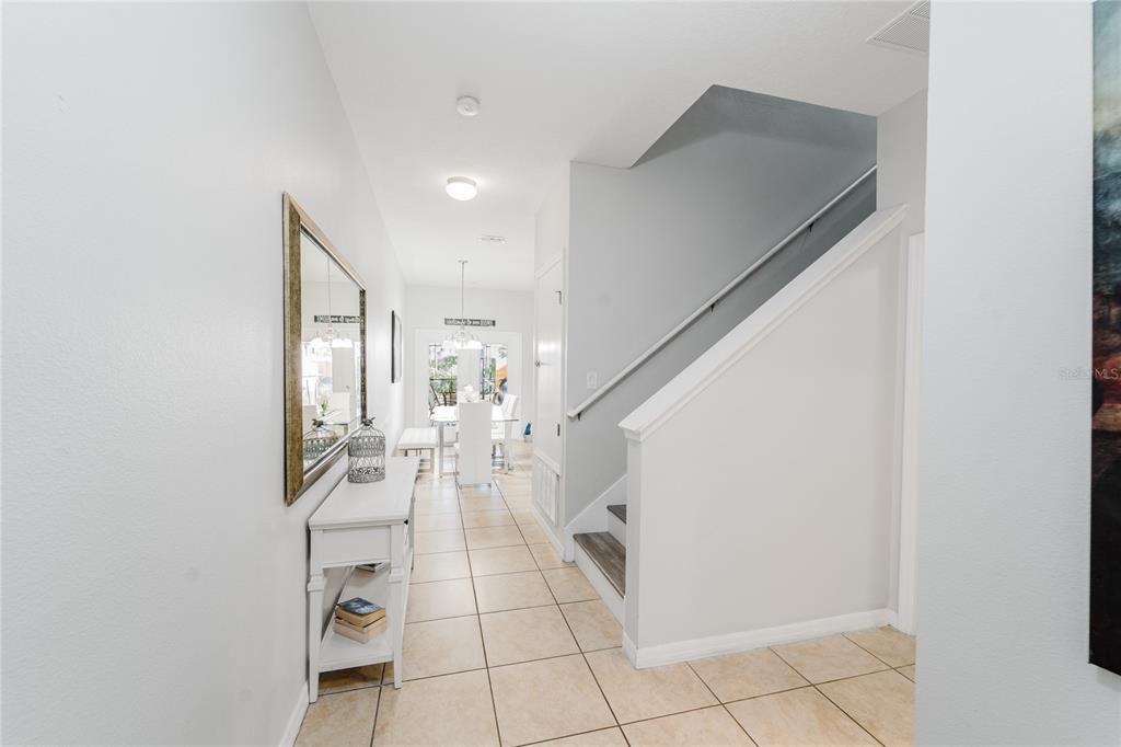 8961 Majesty Palm Road Kissimmee, FL 34747 - Photo 2 of 40 a view of a livingroom with wooden floor and furniture