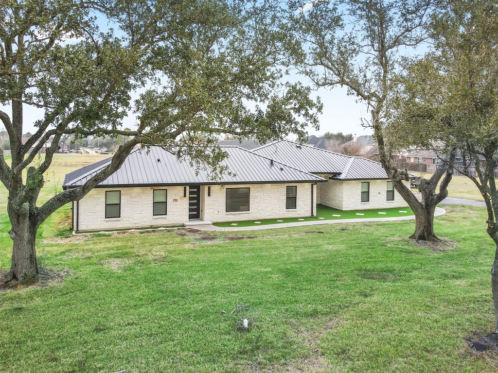 a front view of a house with yard