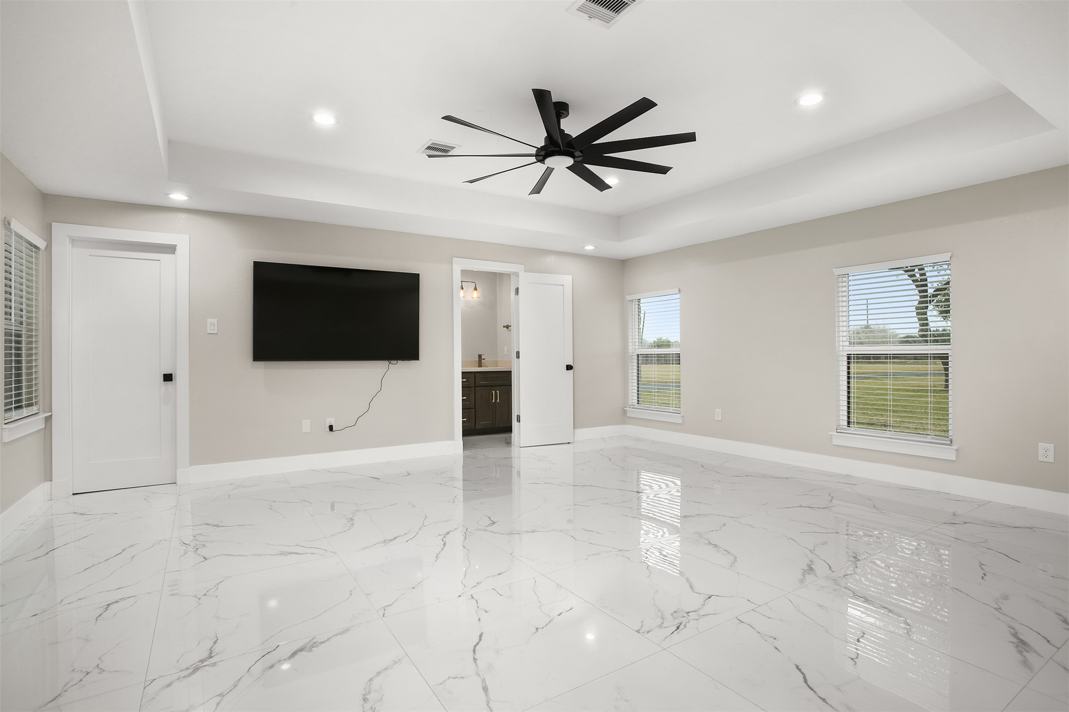 4002 Dixie Farm Road Pearland, TX 77581 - Photo 12 of 29 a view of an empty room with window and a ceiling fan