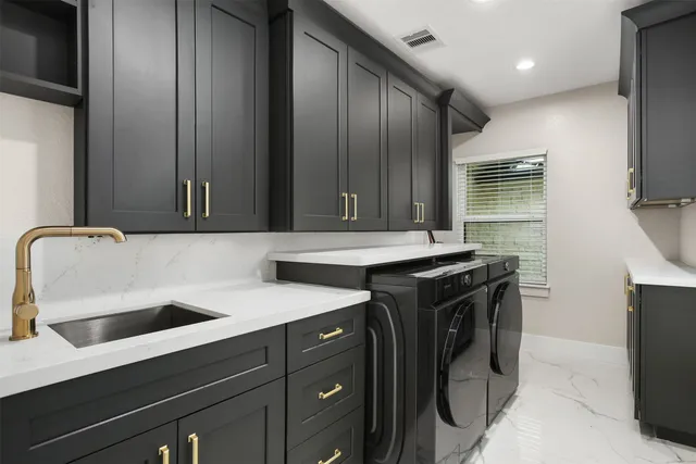 a view of an empty room with window and a flat screen tv
