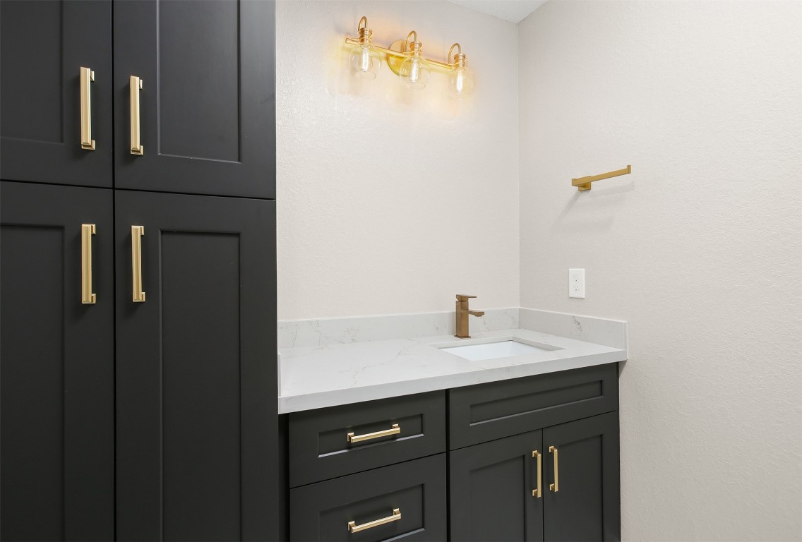 4002 Dixie Farm Road Pearland, TX 77581 - Photo 19 of 29 a sink with a mirror