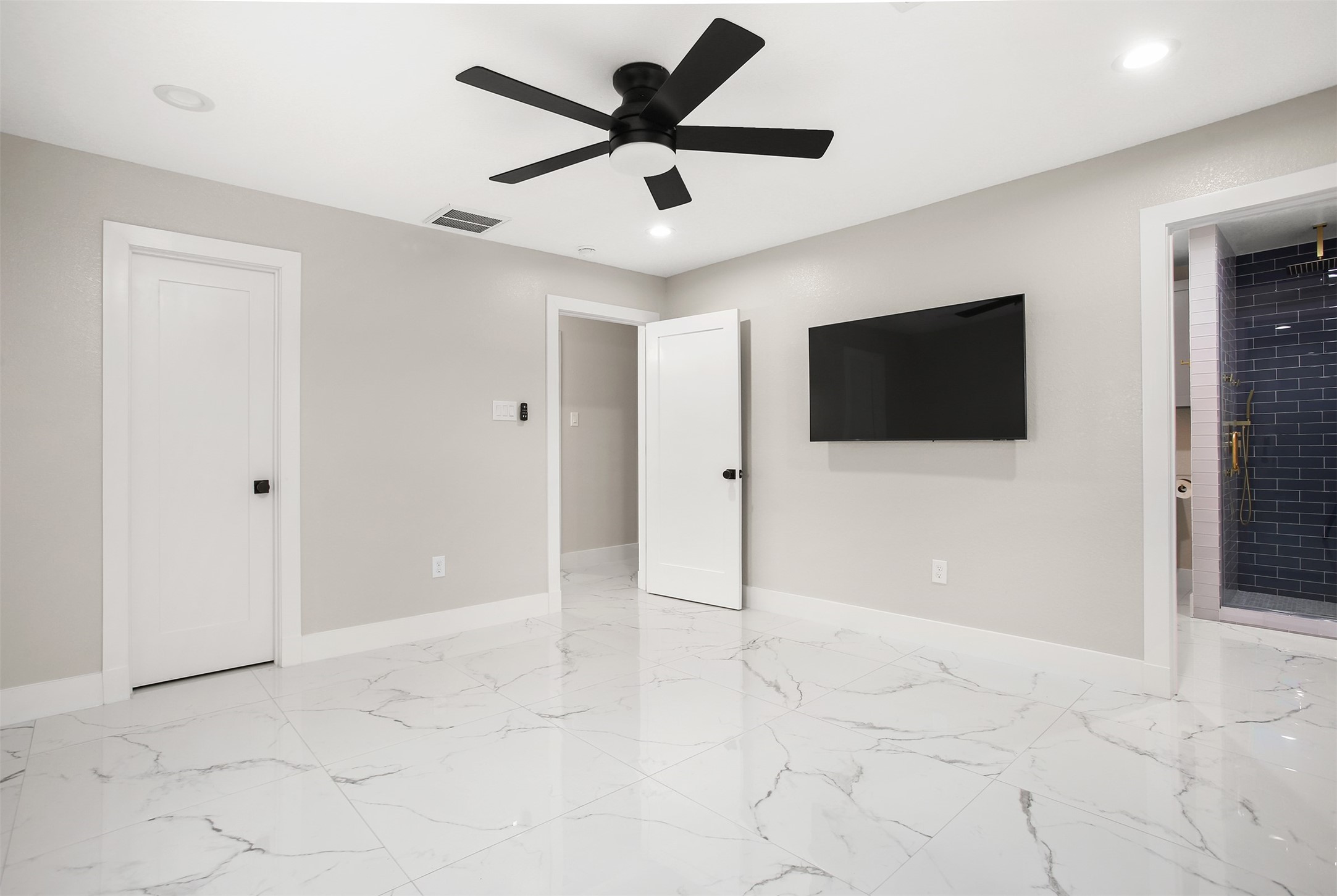 4002 Dixie Farm Road Pearland, TX 77581 - Photo 22 of 29 a view of an empty room with window and a flat screen tv