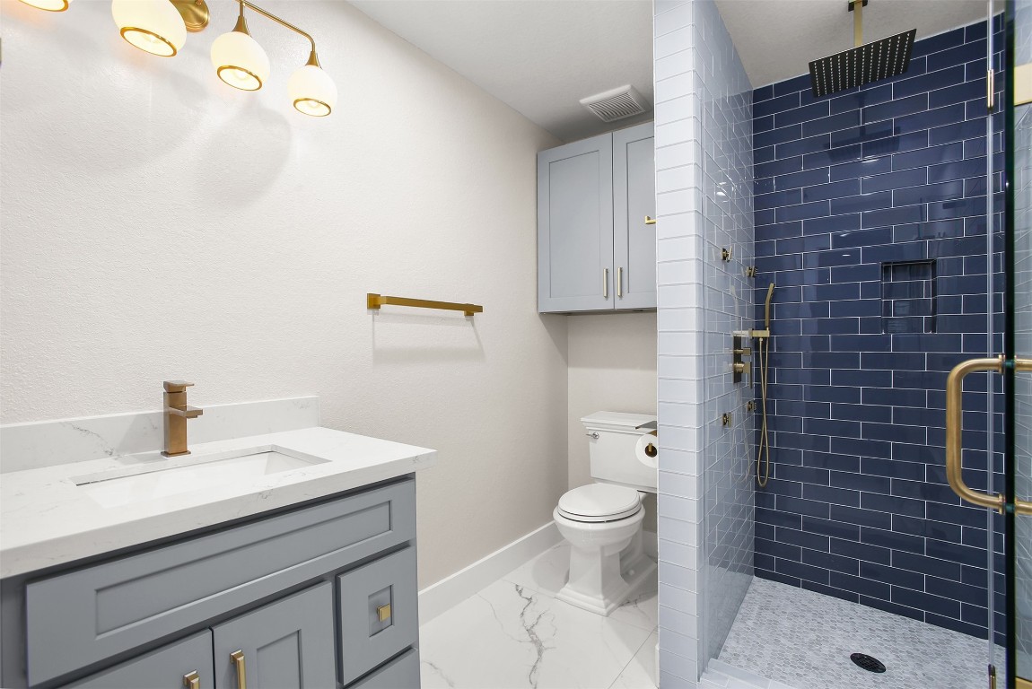 4002 Dixie Farm Road Pearland, TX 77581 - Photo 23 of 29 a bathroom with a sink a toilet and shower