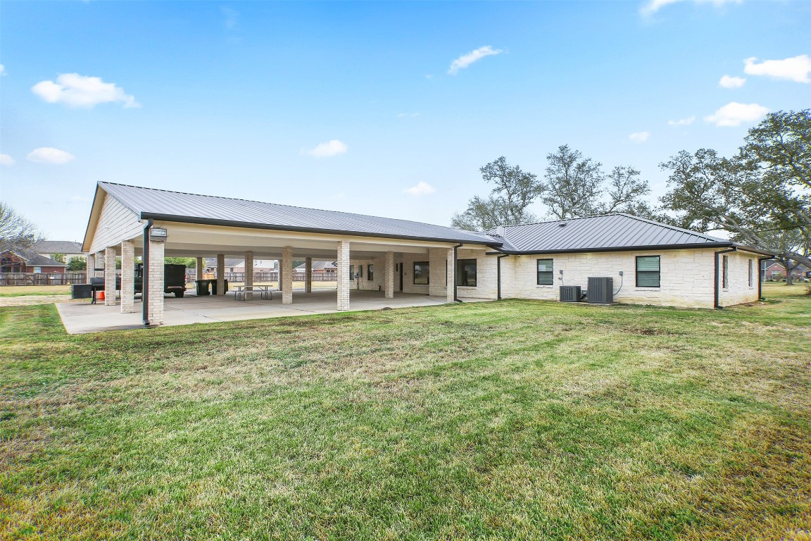 4002 Dixie Farm Road Pearland, TX 77581 - Photo 26 of 29 a front view of a house with a garden