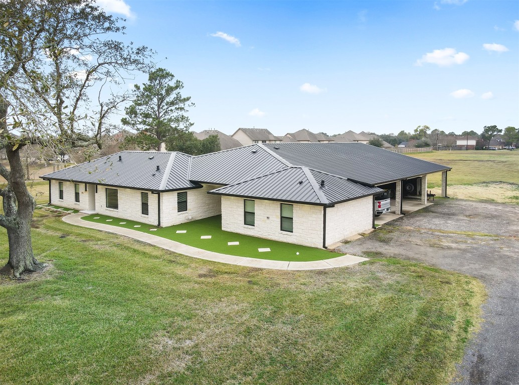 4002 Dixie Farm Road Pearland, TX 77581 - Photo 28 of 29 a view of a big house with a big yard and large tree