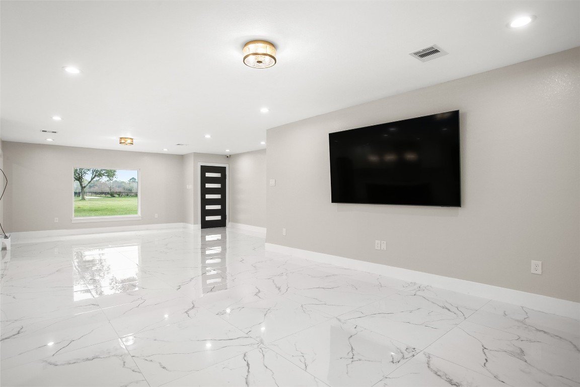 4002 Dixie Farm Road Pearland, TX 77581 - Photo 4 of 29 a view of a livingroom with a flat screen tv