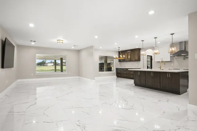 a view of a kitchen with a sink and cabinets