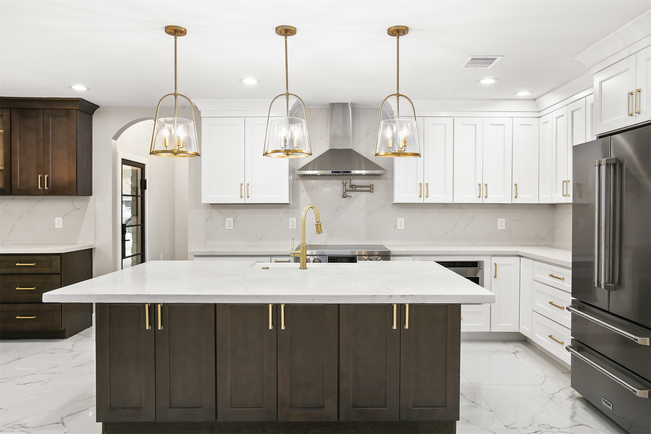 4002 Dixie Farm Road Pearland, TX 77581 - Photo 8 of 29 a kitchen with kitchen island granite countertop a sink a counter space appliances and cabinets