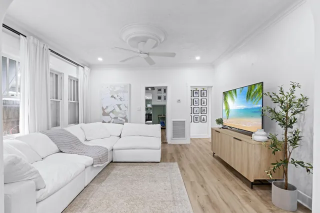 a living room with furniture fireplace and flat screen tv