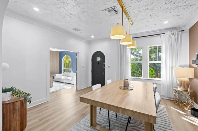 a view of a dining room with furniture window and outside view