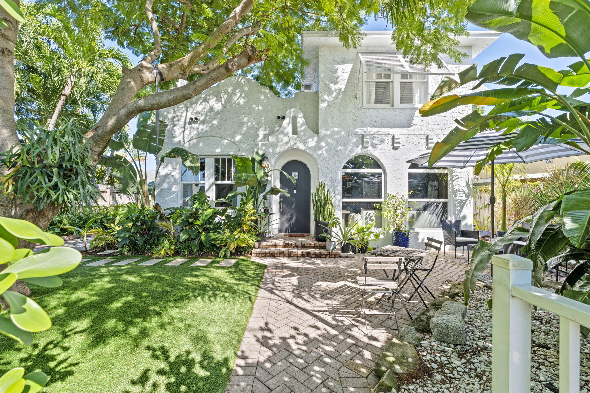 715 Kaye Street West Palm Beach, FL 33405 - Photo 2 of 40 a front view of a house with a garden