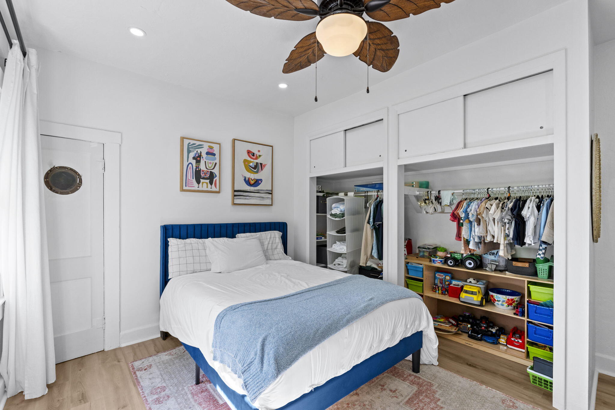 715 Kaye Street West Palm Beach, FL 33405 - Photo 23 of 40 a bedroom with a bed and a book shelf