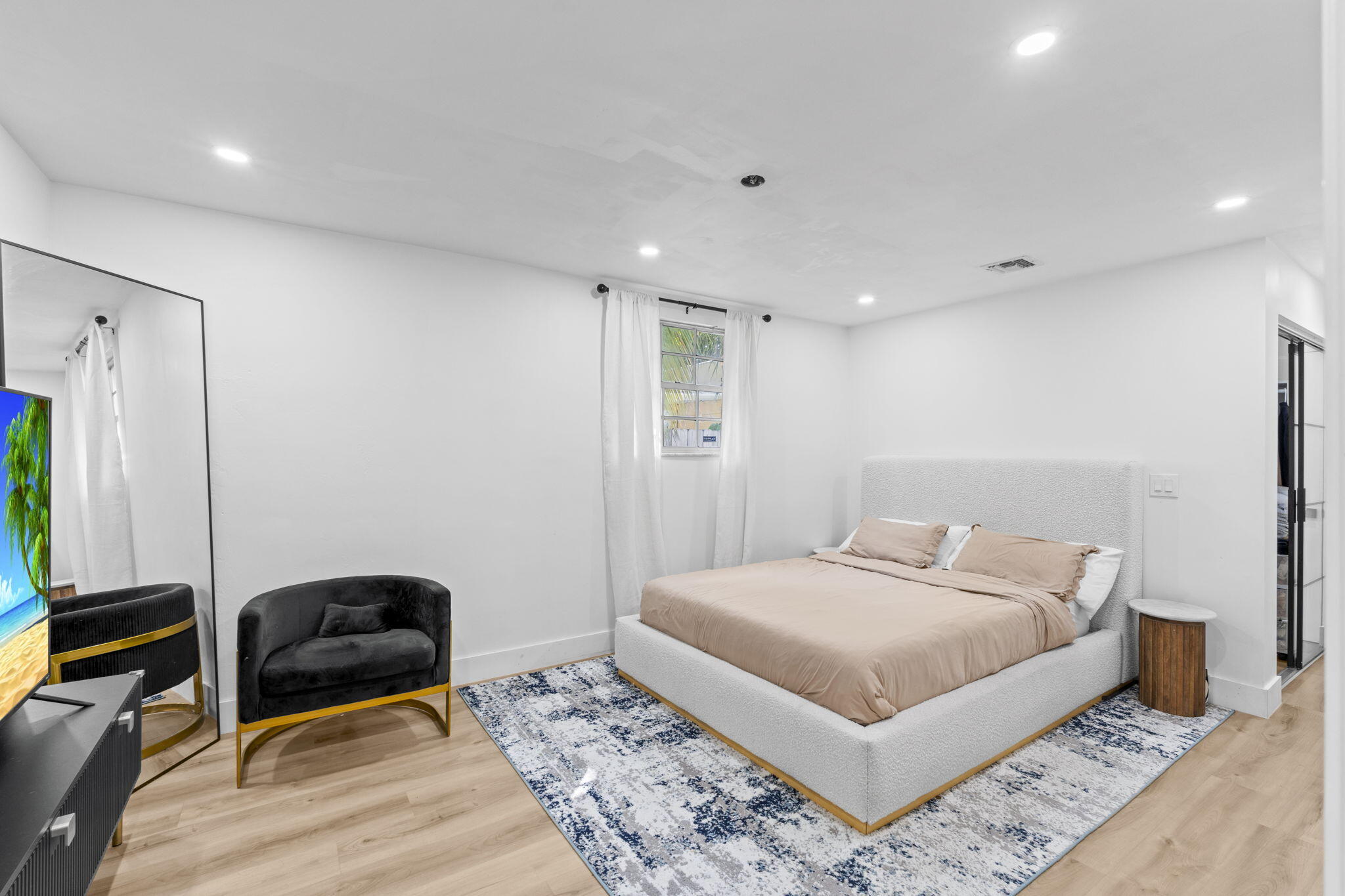 715 Kaye Street West Palm Beach, FL 33405 - Photo 29 of 40 a bedroom with a bed and a dresser