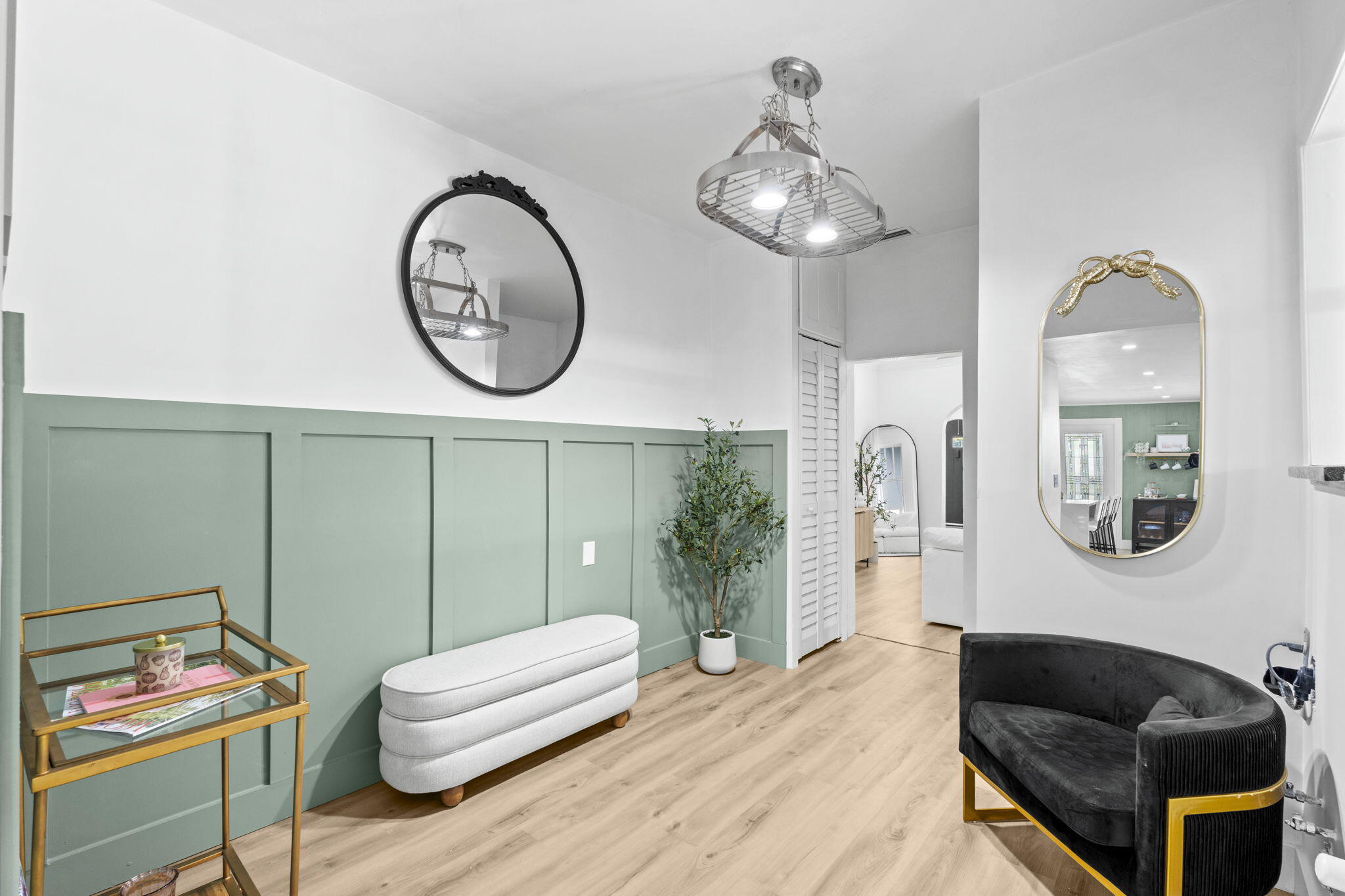 715 Kaye Street West Palm Beach, FL 33405 - Photo 33 of 40 a living room with furniture a mirror and a window