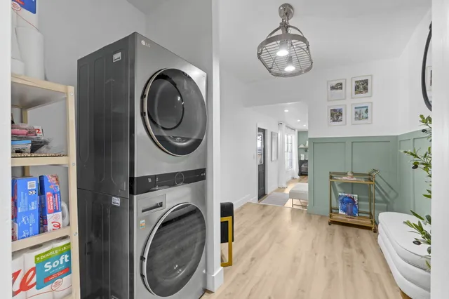 a view of a bedroom with washer and dryer