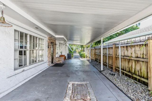 a view of a porch with wooden floor