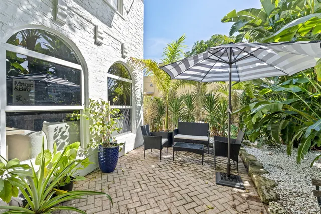 a view of a chairs and table in the patio