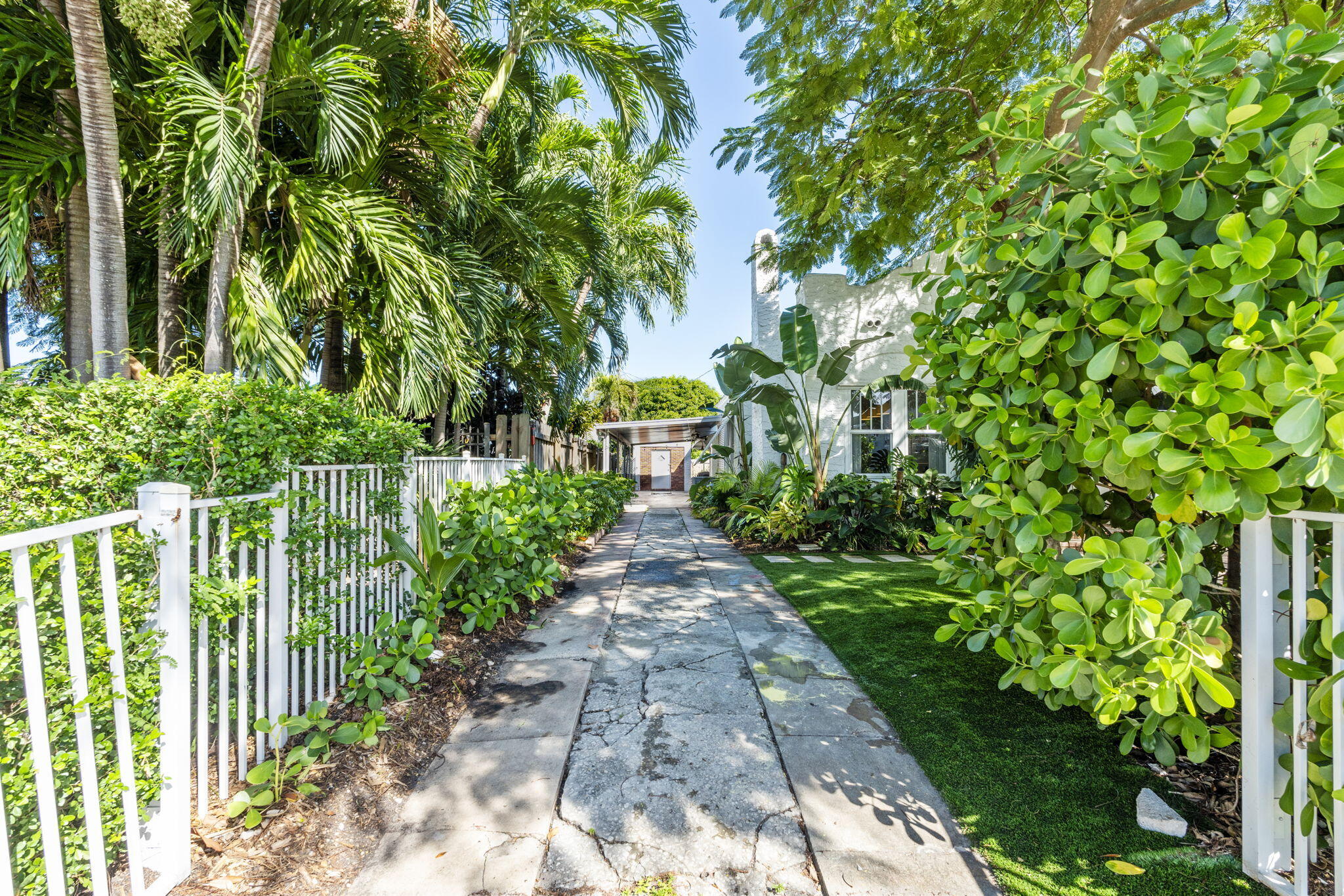 715 Kaye Street West Palm Beach, FL 33405 - Photo 8 of 40 a view of a pathway with plants